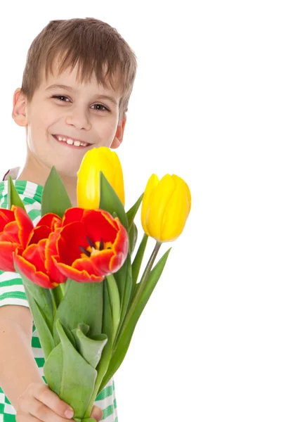 Niño sosteniendo tulipanes —  Fotos de Stock