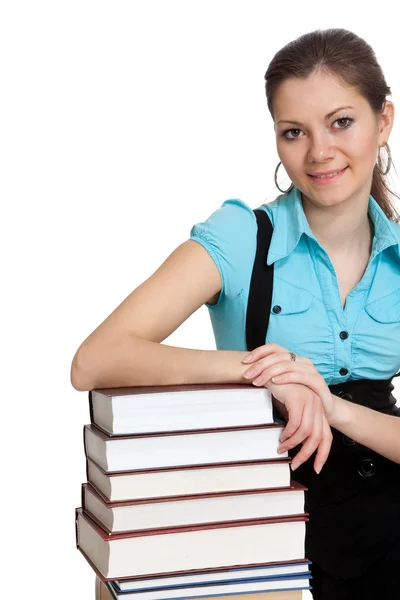 Schöne Studentin hält viele Bücher — Stockfoto