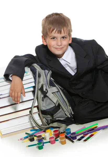 Boy, pencils, paints and books — Stock Photo, Image