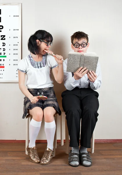 Two person wearing spectacles in an office at the doctor — Stock Photo, Image
