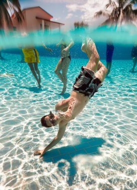 Teenager floats in pool clipart