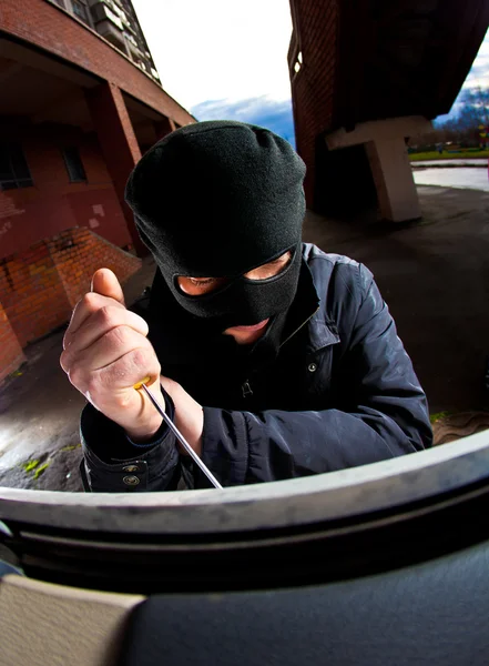 Ladrão com uma máscara — Fotografia de Stock