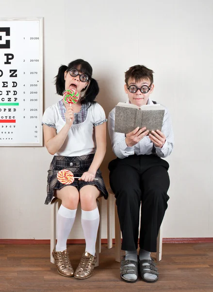 Two person wearing spectacles in an office at the doctor — Stock Photo, Image