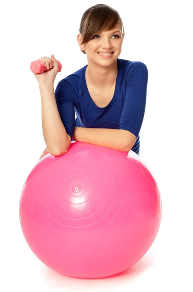 Exercises with dumbbells on a gymnastic ball — Stock Photo, Image