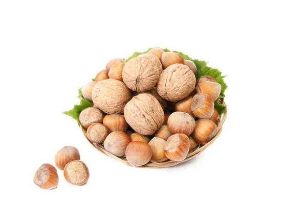 Tasty, ripe nuts in the old basket. — Stock Photo, Image