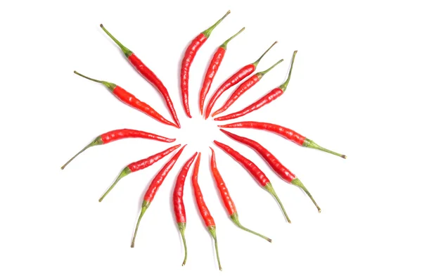 Několik červené papriky na bílé. — Stock fotografie