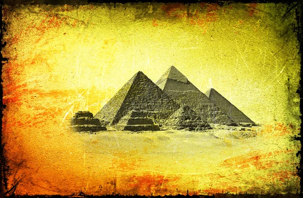 stock image Grunge background with Egyptian pyramids.