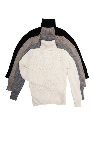 Cztery eleganckie swetry na biały. — Zdjęcie stockowe
