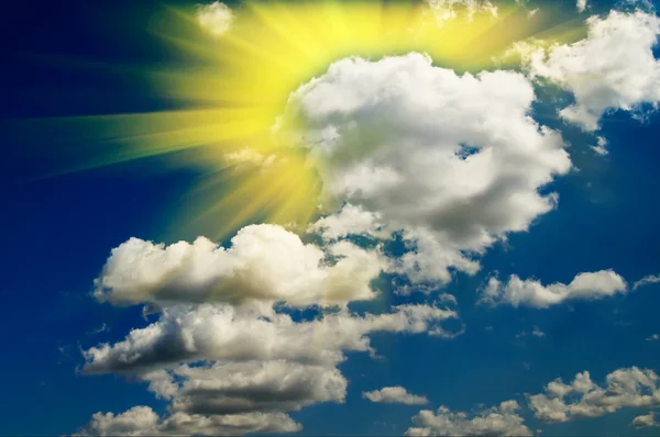 Nice blue sky with clouds and fun sun. — Stock Photo, Image