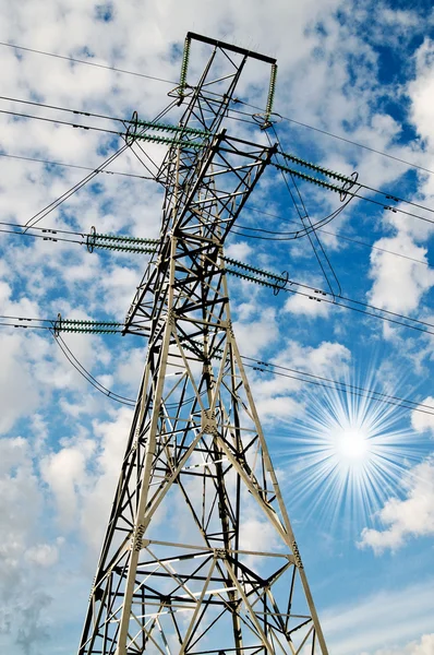 Electrical pylon on a background of the blue sky. — Stock Photo, Image