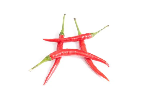 Leuke, smakelijke rode paprika's op een wit. — Stockfoto