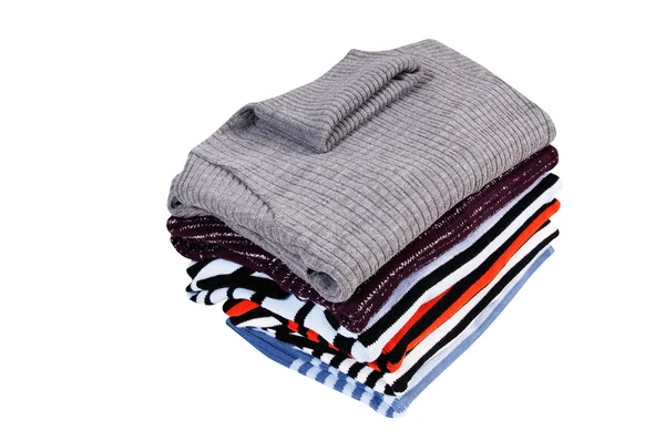 Montón de suéteres en un blanco . —  Fotos de Stock