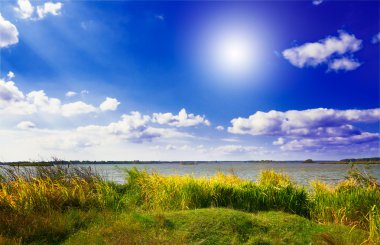 Splendid big lake by autumn. clipart