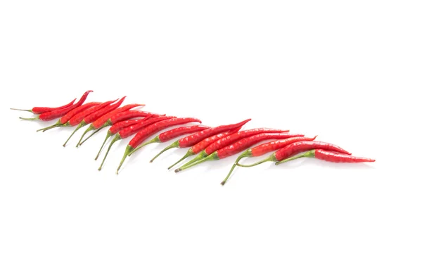 Červené papriky na bílé. — Stock fotografie