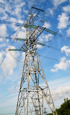 Wonderful blue sky and electrical pylon. clipart