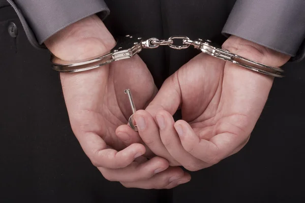 Arrested in handcuffs — Stock Photo, Image