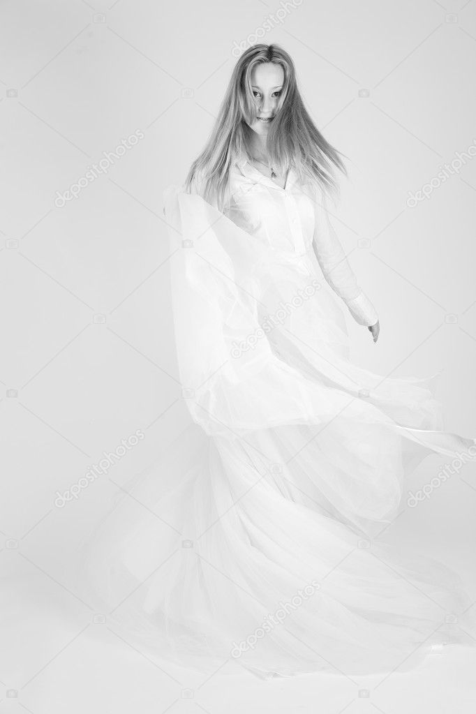 Monochrome shot of dancing girl with long skirt