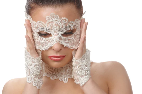 Beautiful woman with tender face in lace mask over her eyes — Stock Photo, Image