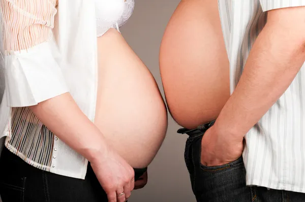 Pregnant and fat bellies — Stock Photo, Image