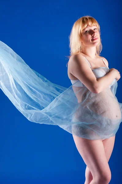 Pregnant woman with weightless fabric — Stock Photo, Image