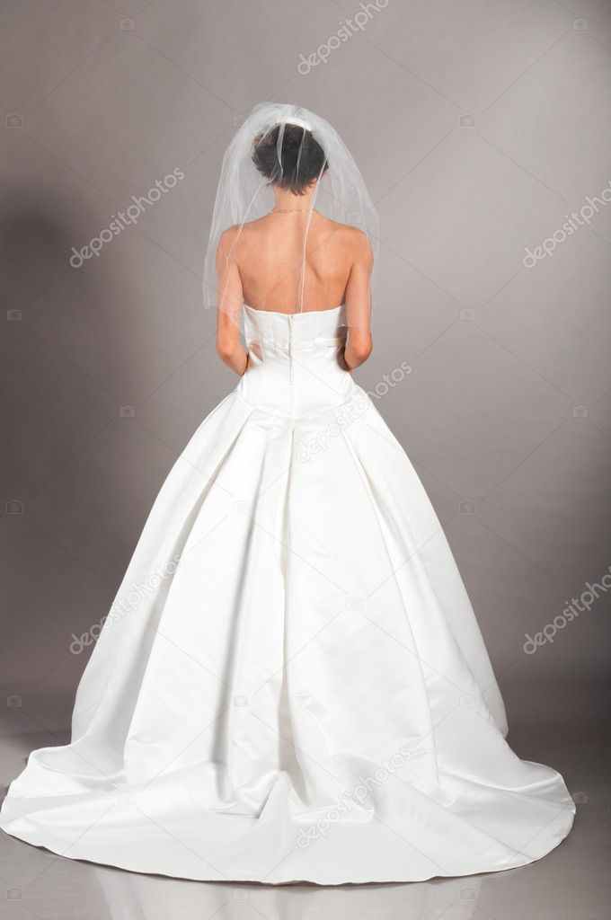Beautiful bride on grey background