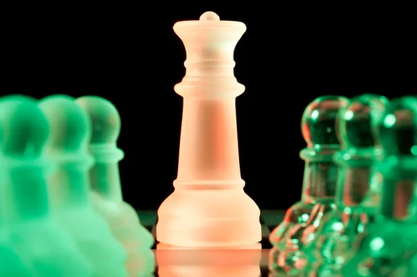 Red and green glass chess pieces — Stock Photo, Image