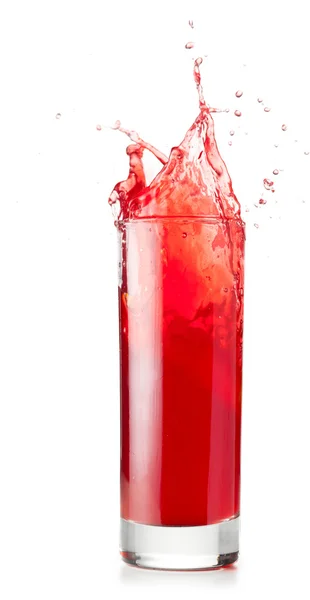 Líquido rojo es spalsing en vidrio — Foto de Stock
