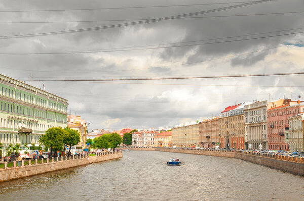 View of Fontanka canal with dramatic skies, Saint-Petersburg, Russia