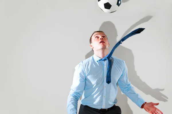 Business man is playing football — Stock Photo, Image