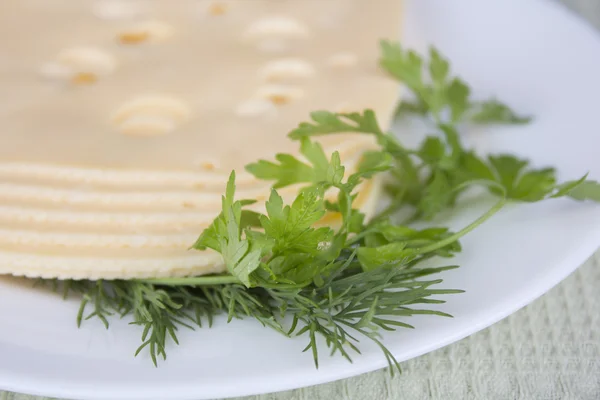 Plate with pieces cheese — Stok Foto