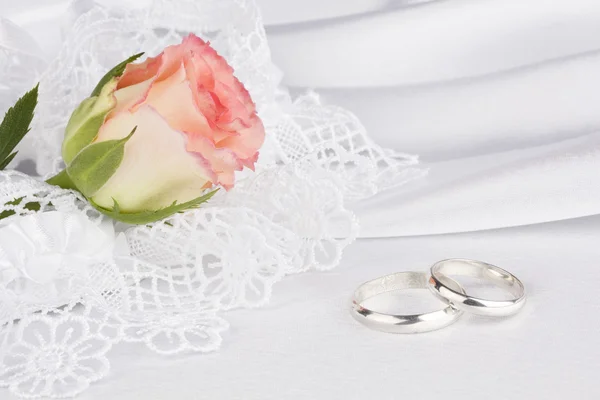 White silk with a lace and rose — Stock Photo, Image