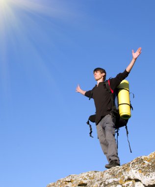 Man on top of mountain. clipart