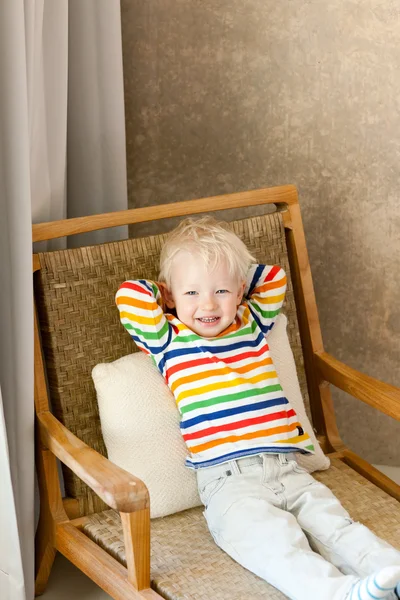 Toddler lying in the chair — Stock Photo, Image