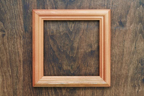 Moldura de fotos na parede de madeira — Fotografia de Stock