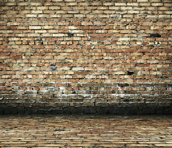 Quarto com uma parede de tijolo — Fotografia de Stock