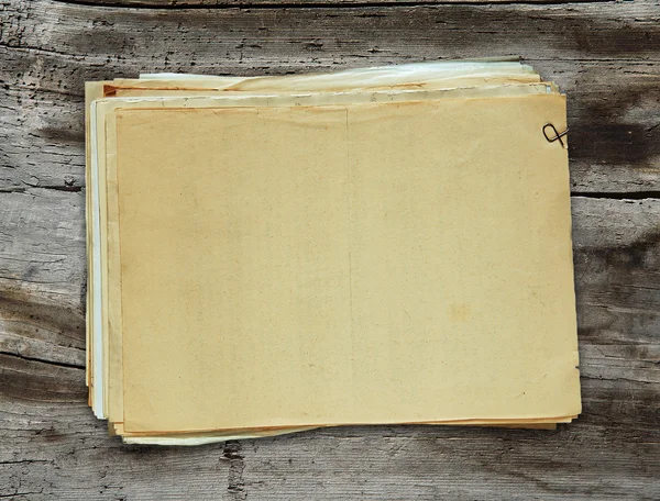 Old papers on wooden background — Stock Photo, Image