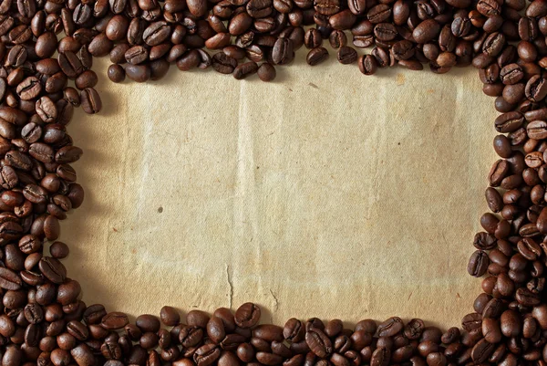 Coffee beans on paper Royalty Free Stock Images