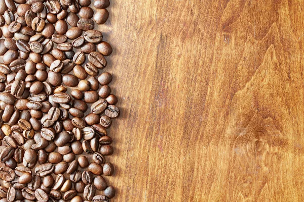 Coffee beans on table — Stock Photo, Image