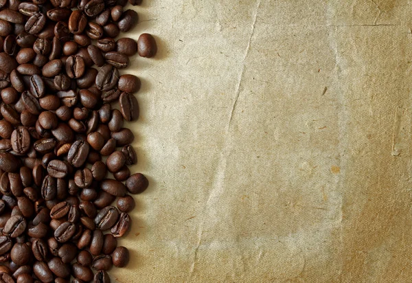 stock image Coffee beans on old paper