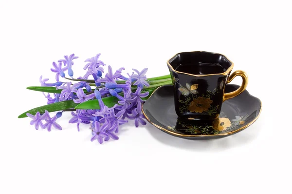 Šálek kávy s květinami — Stock fotografie