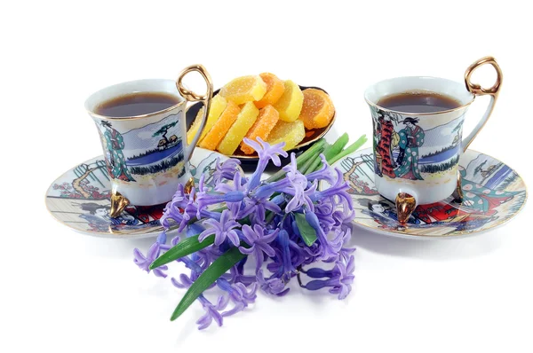 Two cups of coffee with flowers — Stock Photo, Image