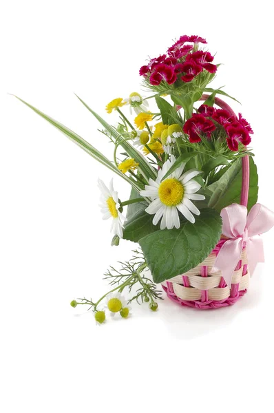 Wattled basket from a rod with natural flowers — Stock Photo, Image