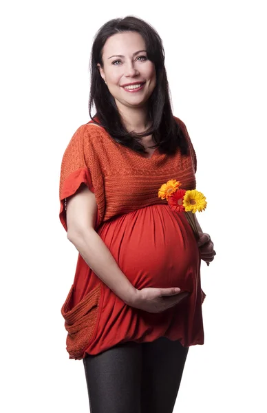 Erwachsene schwangere Frau mit Blumen — Stockfoto