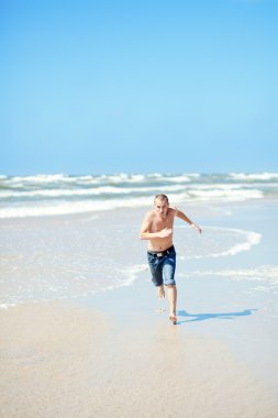 Man on the beach clipart