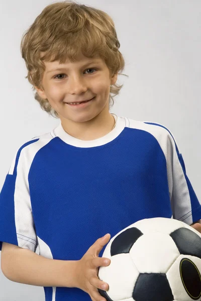 O jovem jogador de futebol Imagens De Bancos De Imagens