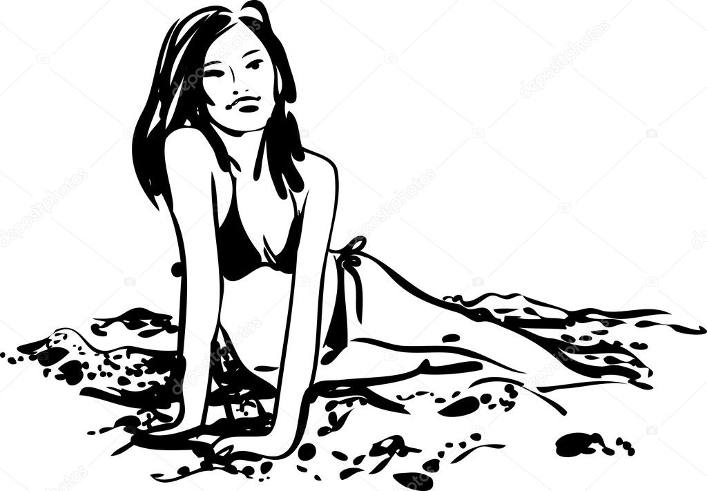 Girl in bikini sunbathing on the sand beach
