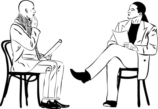 Two men sitting reading something on a wooden chair