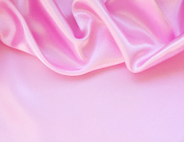 Гладкий елегантний рожевий шовк як фон — стокове фото