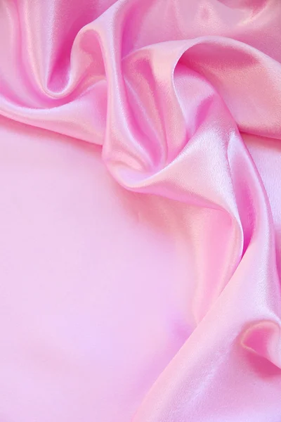 Sima, elegáns rózsaszín selyem háttereként — Stock Fotó
