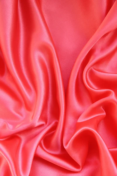 ผ้าไหมสีแดงเรียบเป็นพื้นหลัง — ภาพถ่ายสต็อก